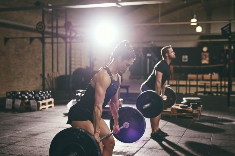 74469947 - strong fit people deadlifting barbells. horizontal indoors shot