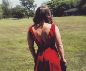 A powerlifter in a red dress