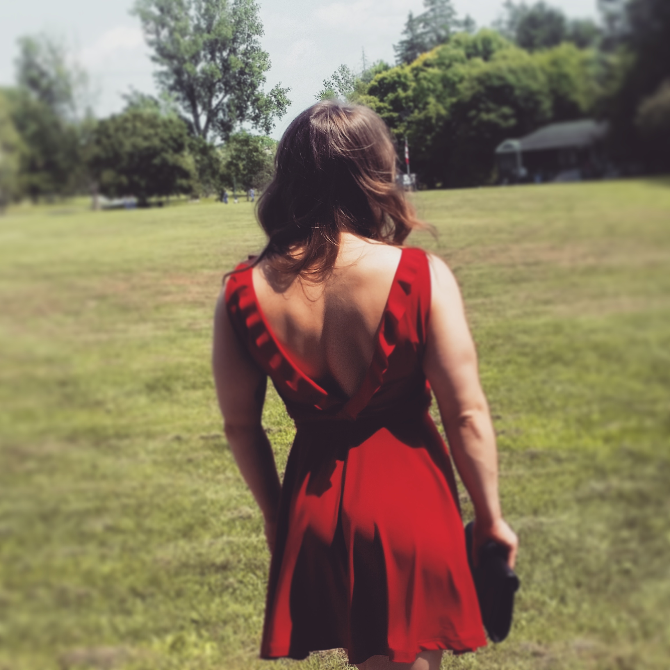 A powerlifter in a red dress