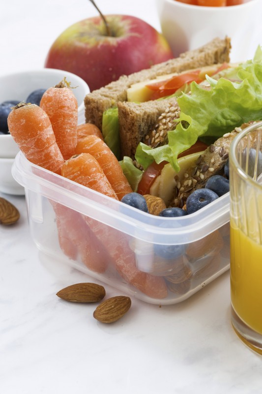 lunch box with sandwich of wholemeal bread on white table