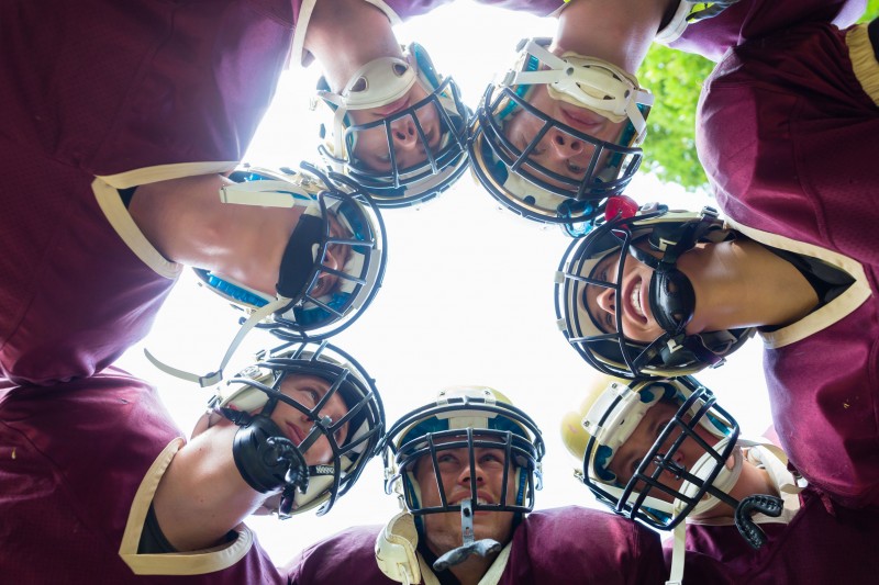 45826210 - american football team having huddle in match