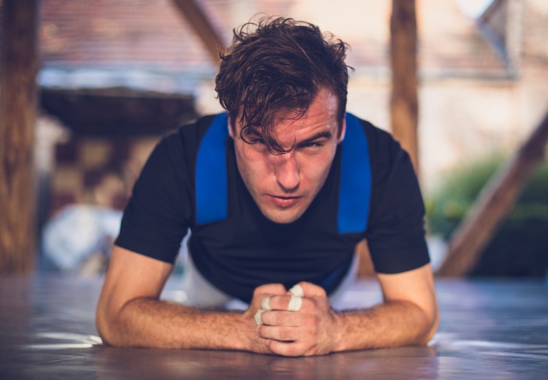 Young Man Doing Elbow Plank Workout