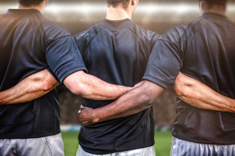 Composite image of rugby fans in arena