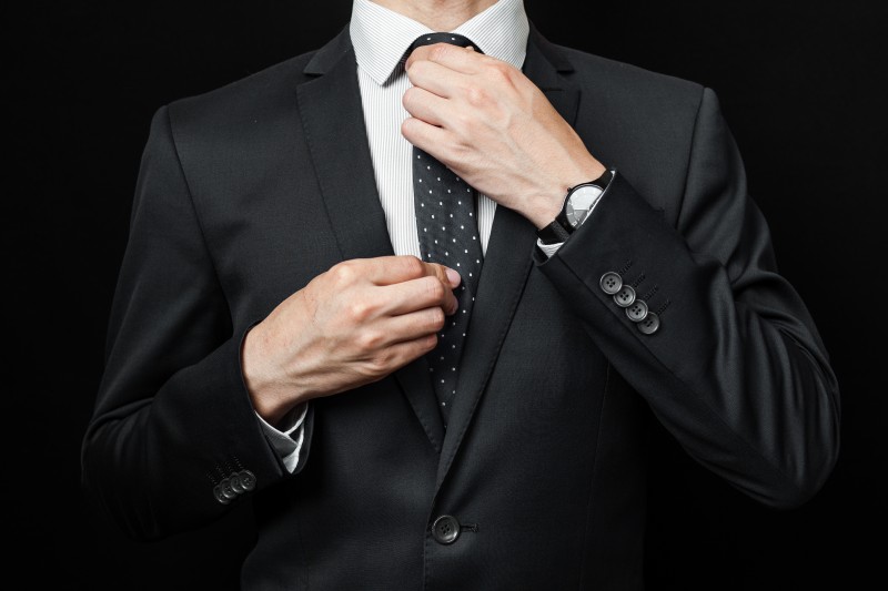 man in suit on a black background