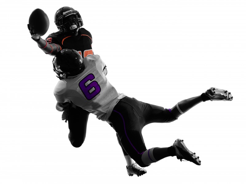 two american football players tackle silhouette