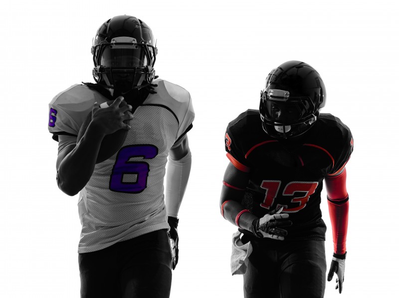 two american football players running silhouette