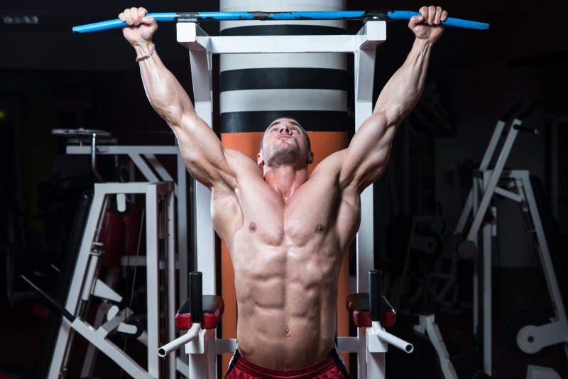 Young Bodybuilder Doing Heavy Weight Exercise For Back