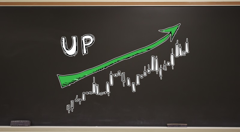 Market up trend chart on a blackboard