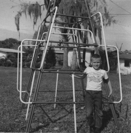 Boy_in_front_of_jungle_gym,_1967