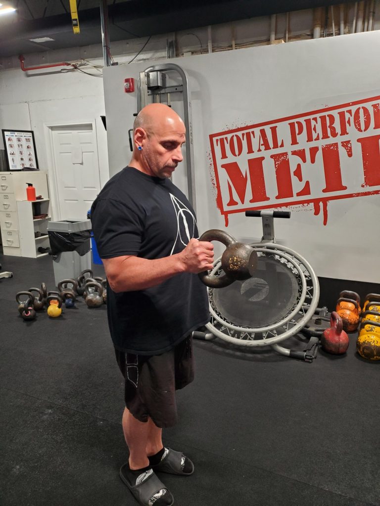 The Two Best Bicep Exercises You’re Not Doing, C.J. Murphy, Spider Curl, Kettlebell Curl, powerlifting, strongman; 