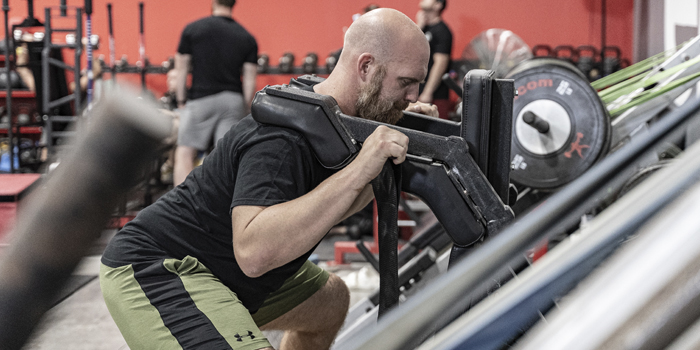 Premium Photo  Get down and give it all youve got portrait of a fit young woman  doing squats in a gym